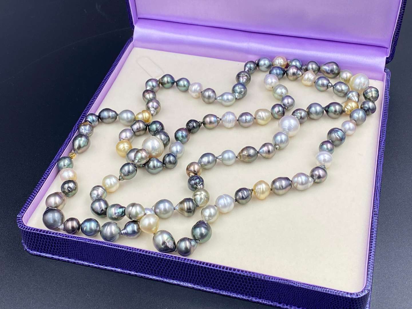 <p>SCHOEFFEL, a signed, single strand of colored freshwater pearls.</p>