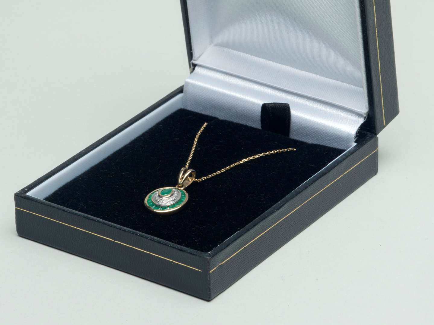 <p>Emerald and diamond pendant with chain</p>