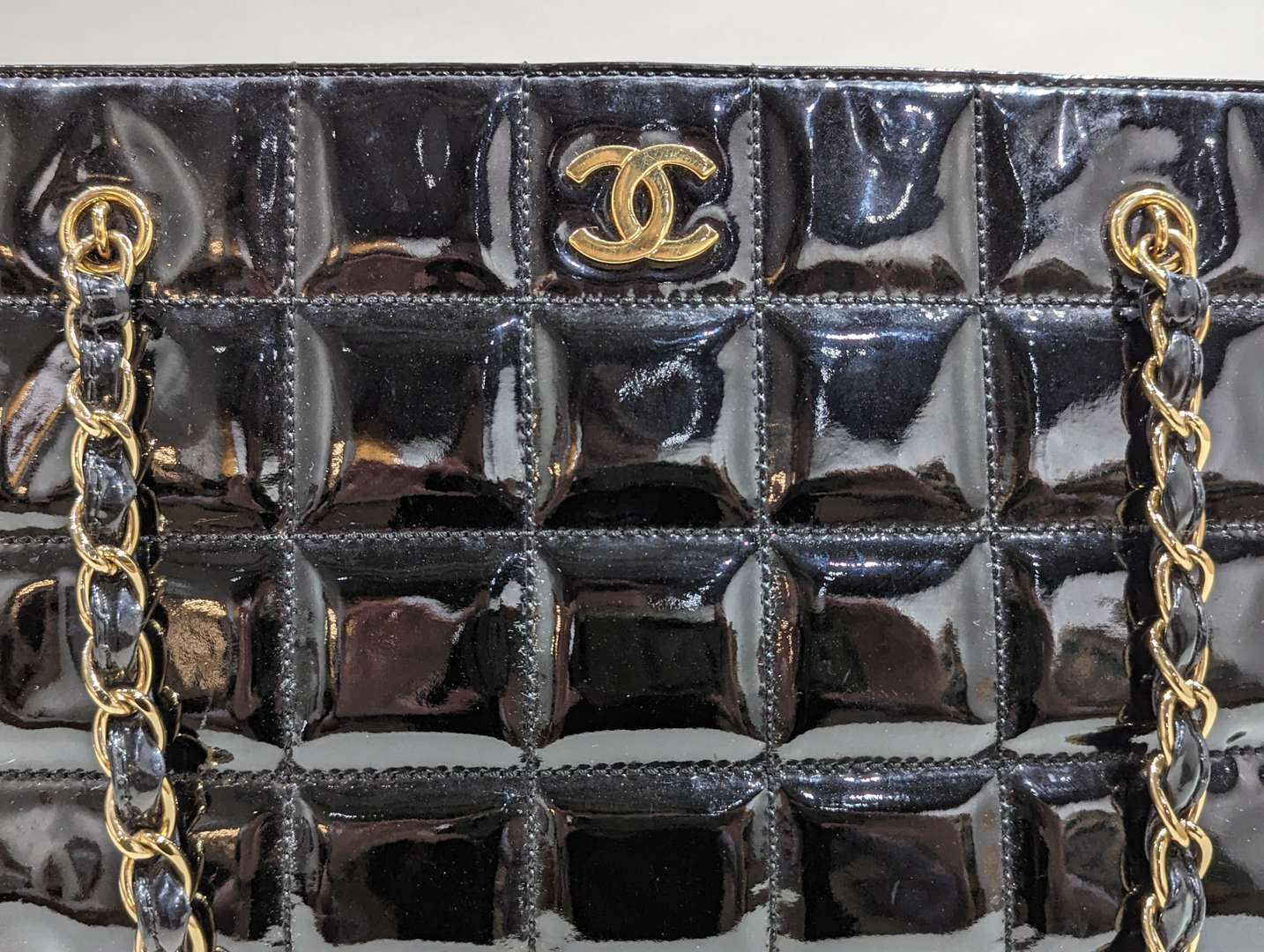 <p>Chanel vintage quilted patent chocolate bar tote</p>