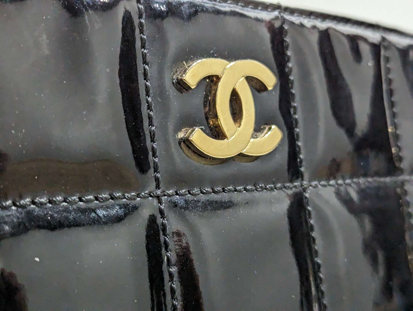 <p>Chanel vintage quilted patent chocolate bar tote</p>