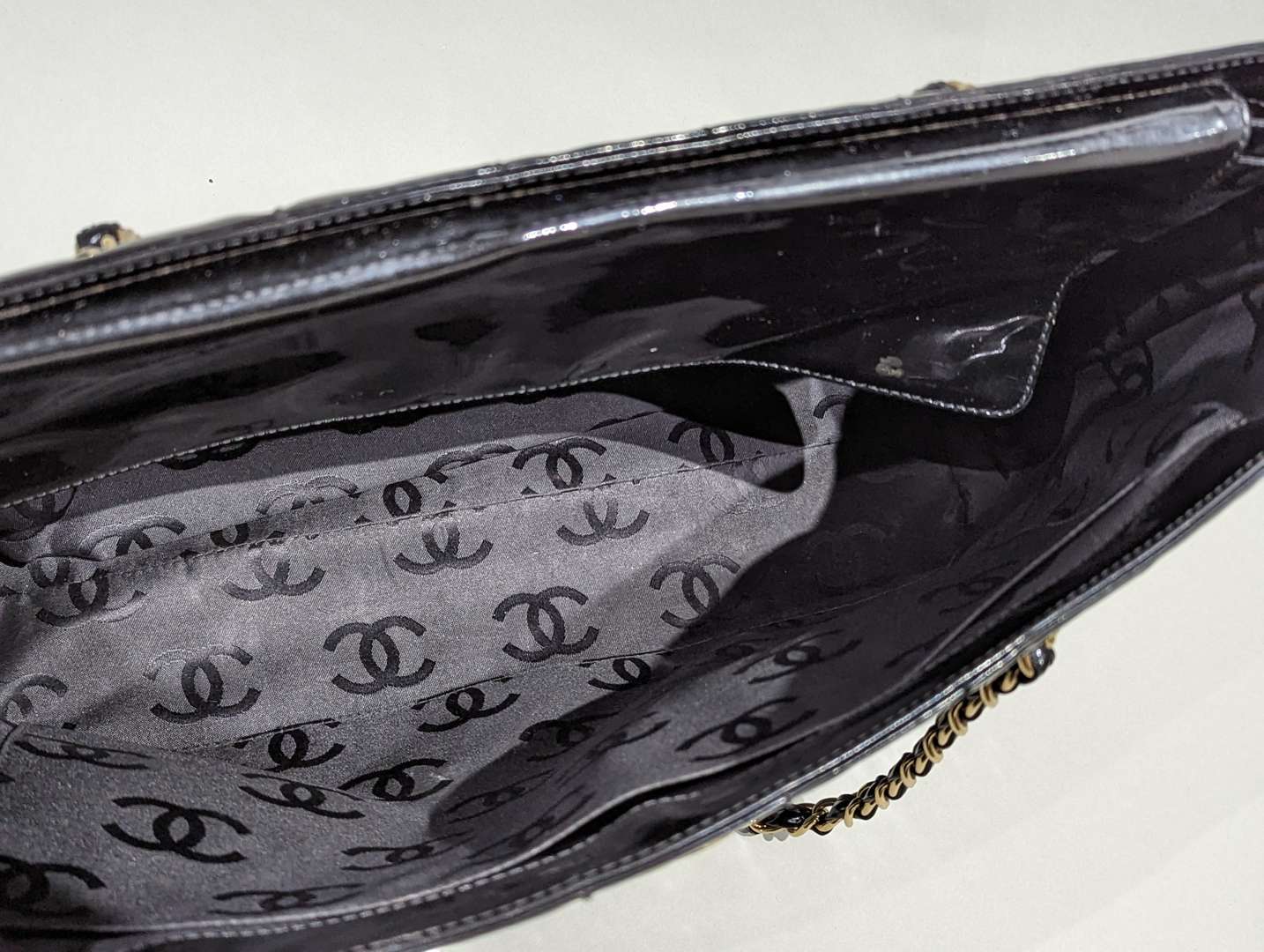 <p>Chanel vintage quilted patent chocolate bar tote</p>