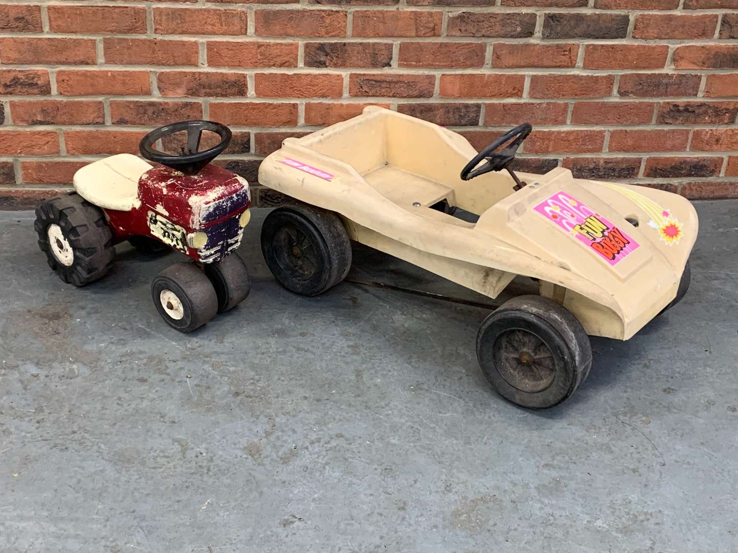 <p>Plastic Child's “Fun Buggy” and Pedal Tractor (2)</p>