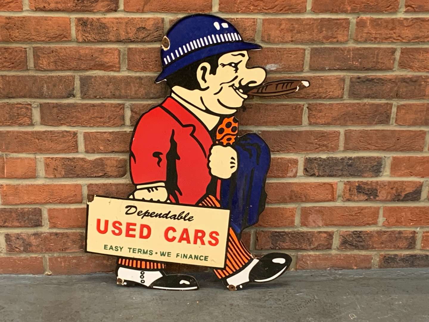 <p>Dependable Used Car Salesman Enamel Sign</p>