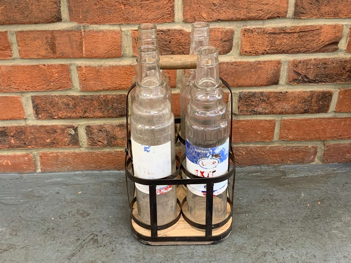 <p>Four Glass Esso Oil Bottles and Holder</p>