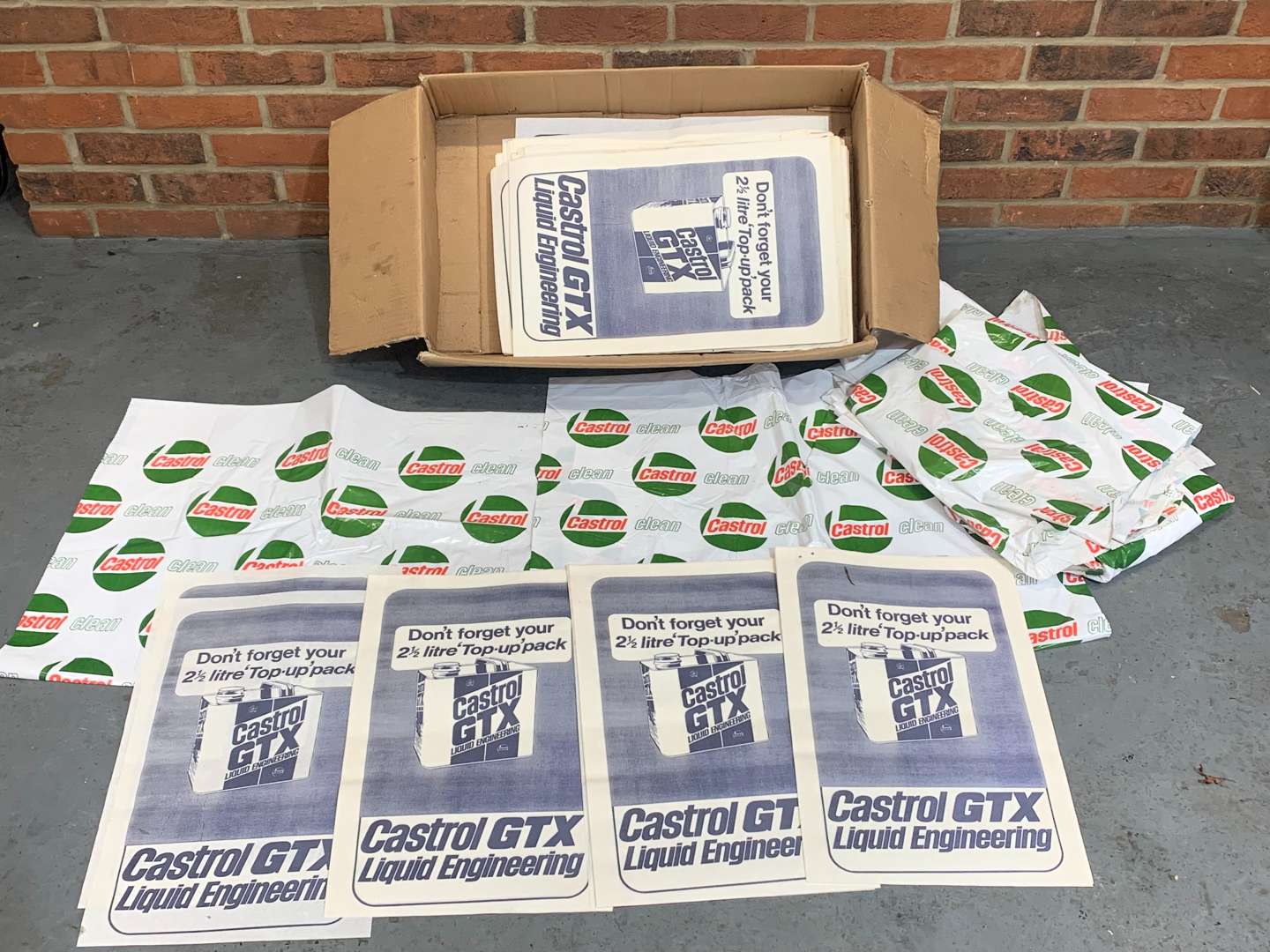 <p>Box of New Old Stock Castrol Seat Covers and Floor Mats</p>