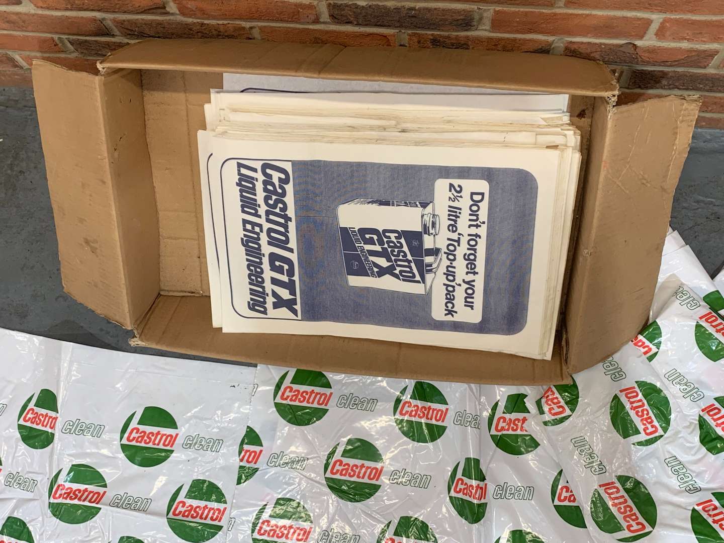 <p>Box of New Old Stock Castrol Seat Covers and Floor Mats</p>