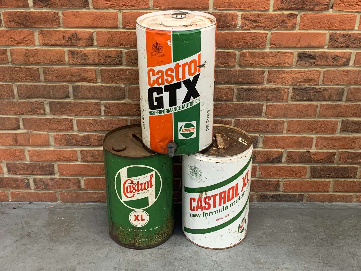 <p>Three Five Gallon Castrol Oil Drums</p>