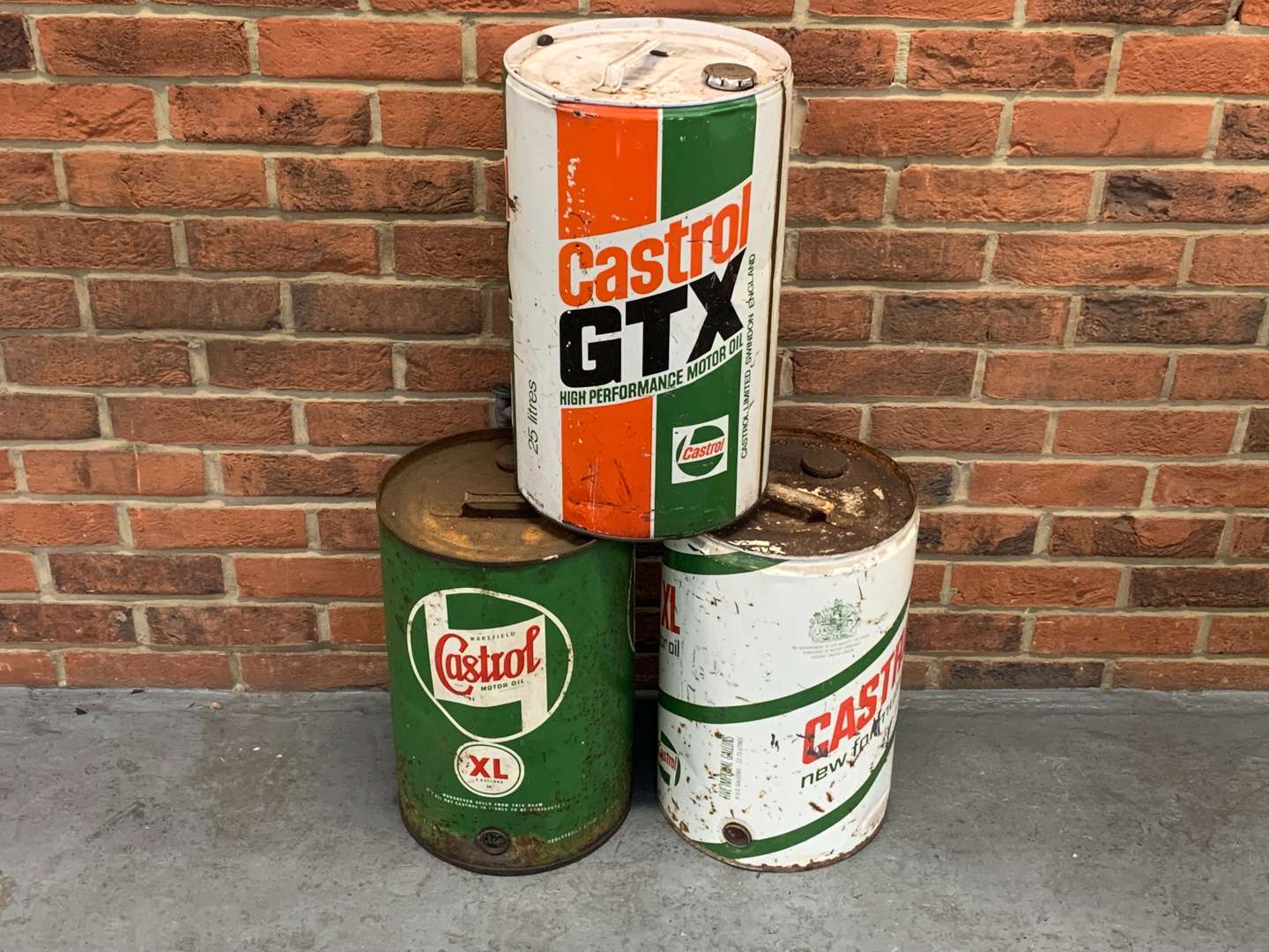 <p>Three Five Gallon Castrol Oil Drums</p>