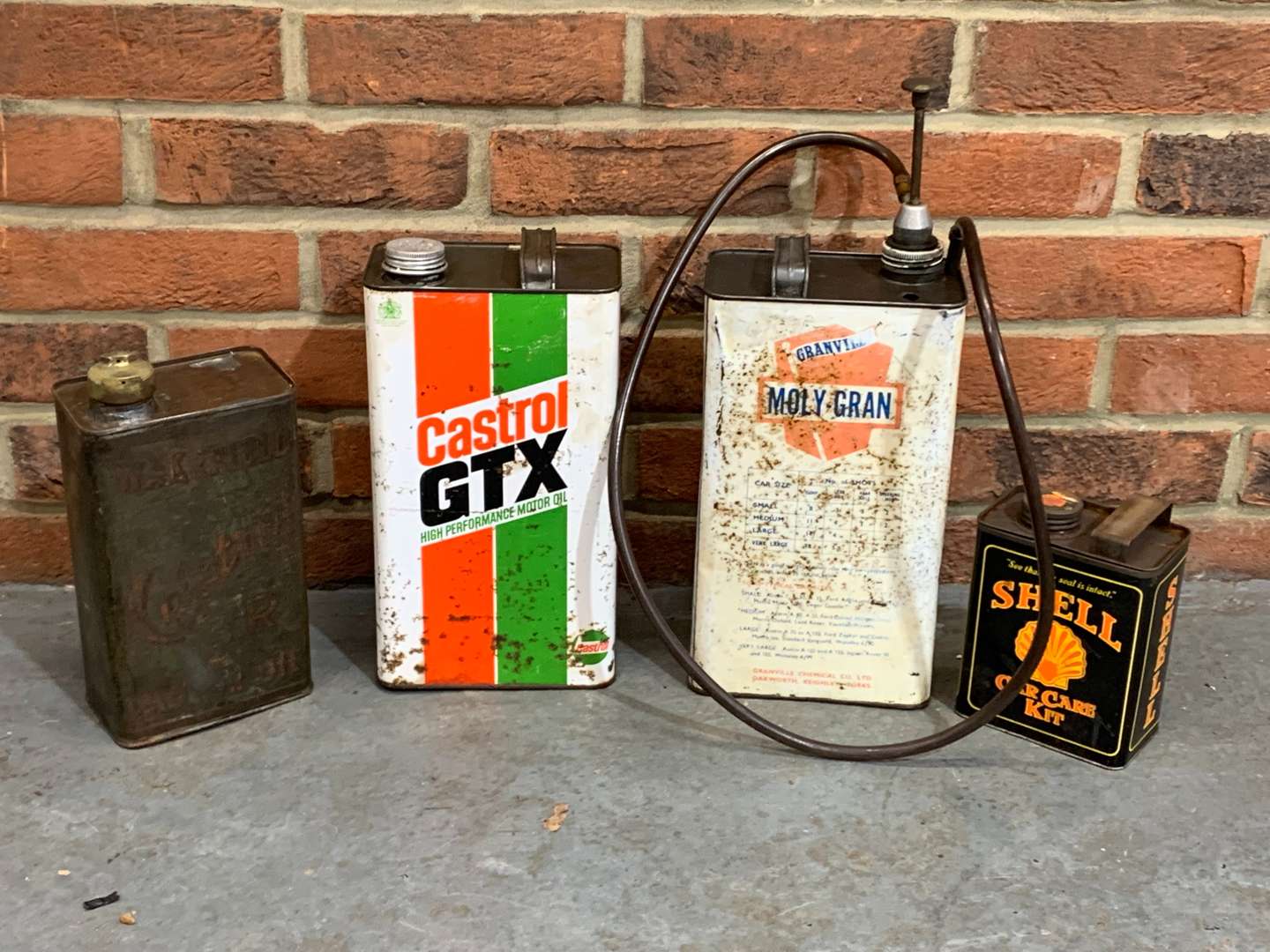 <p>Three Oil Cans and Shell Car Care Kit Can (4)</p>