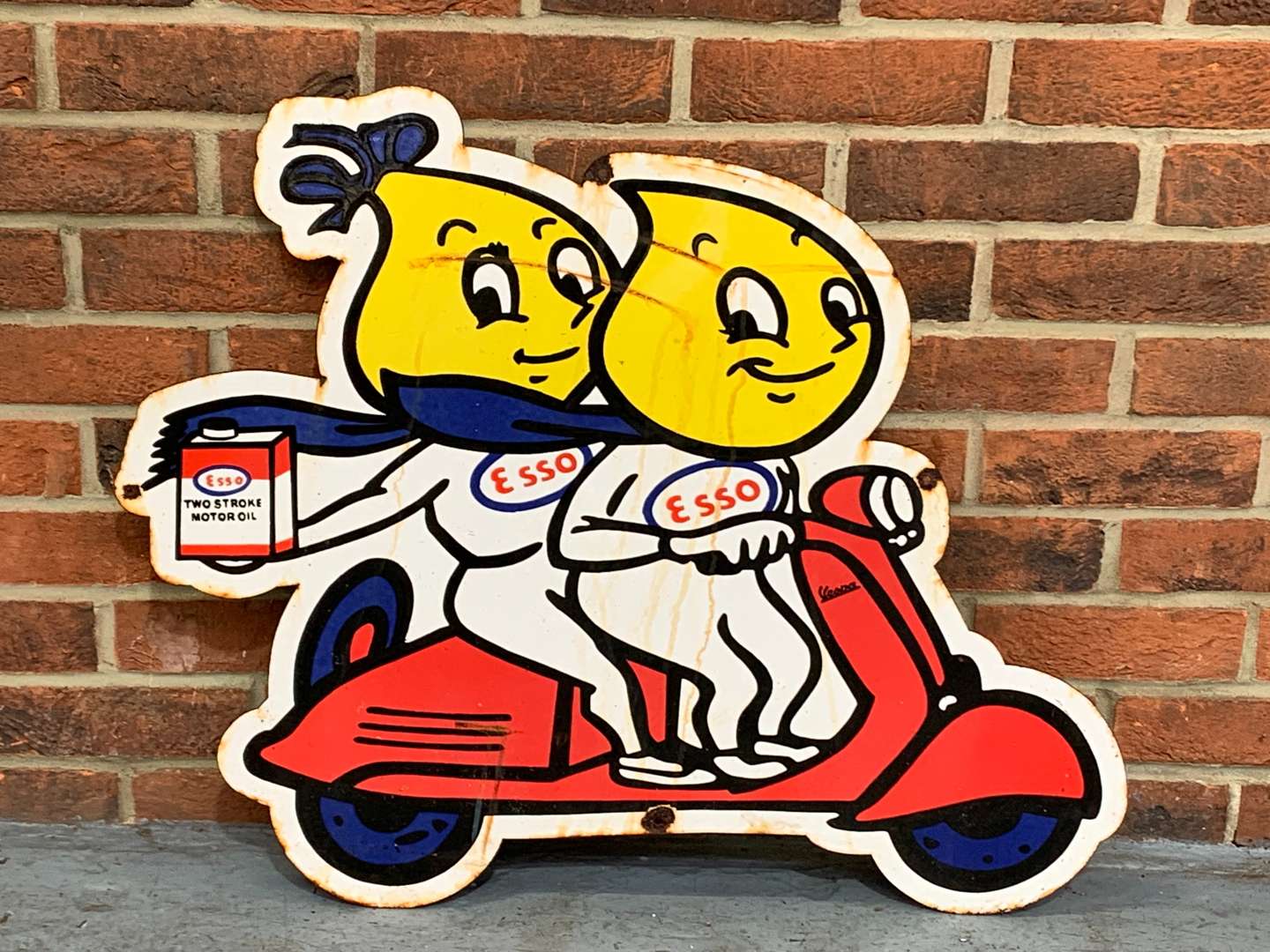 <p>Mr and Mrs Drip on a Scooter Enamel Sign</p>