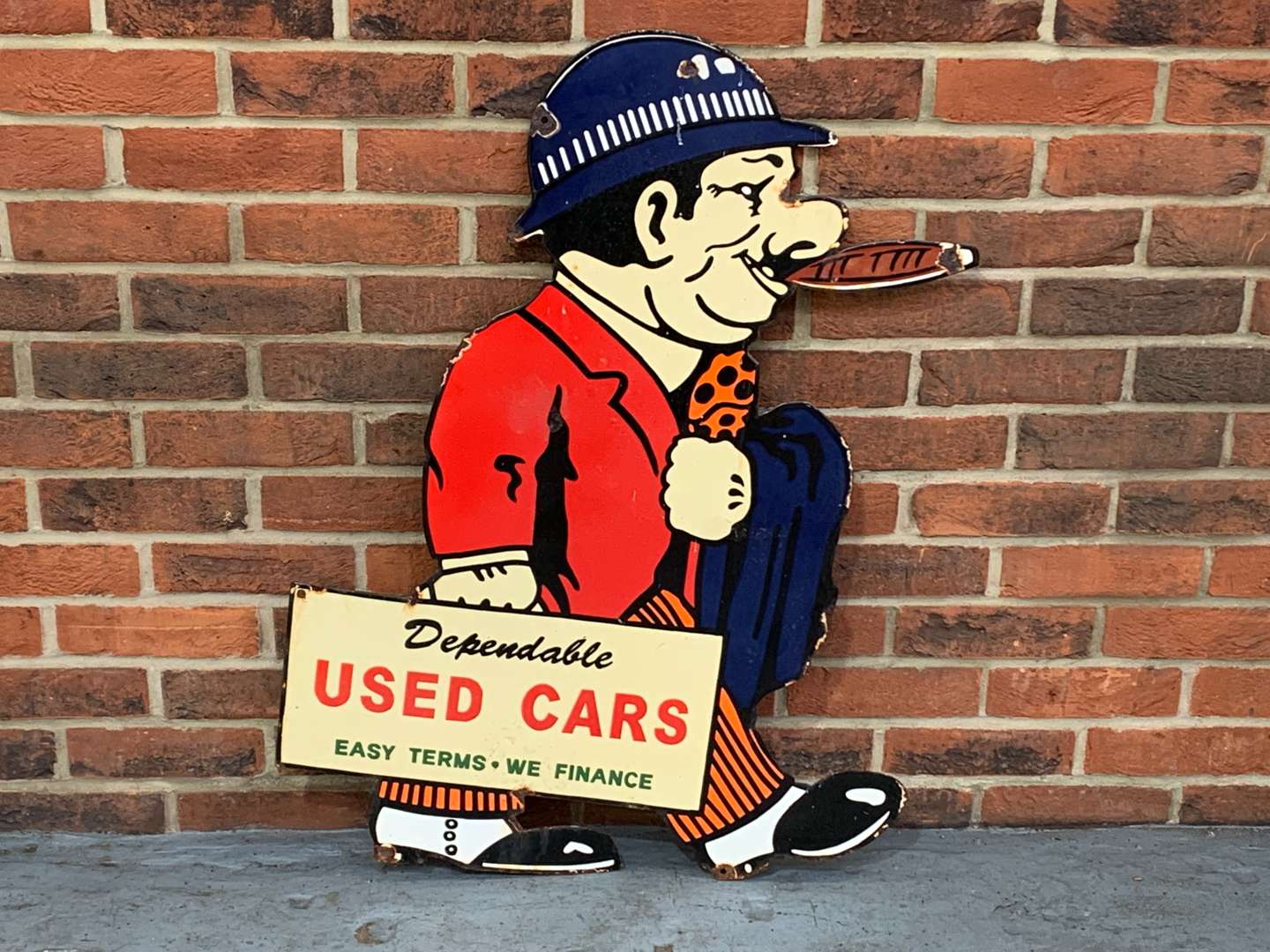 <p>Dependable Used Car Salesman Enamel Sign</p>