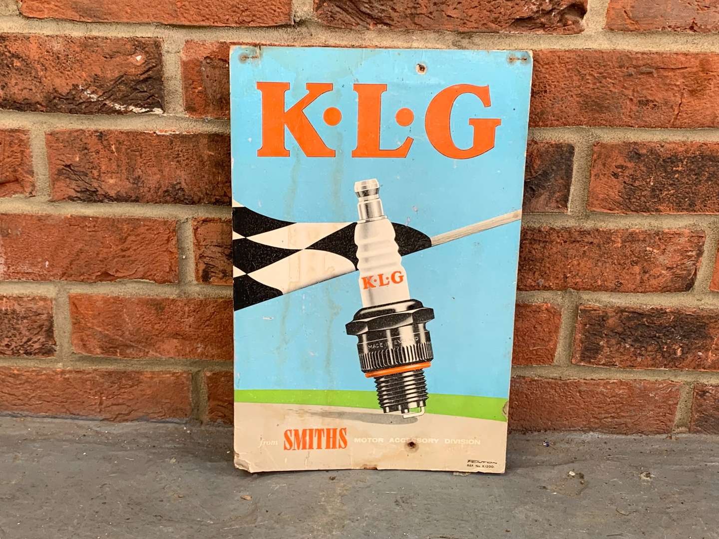 <p>Original K.L.G Spark Plugs Smiths Cardboard Sign</p>