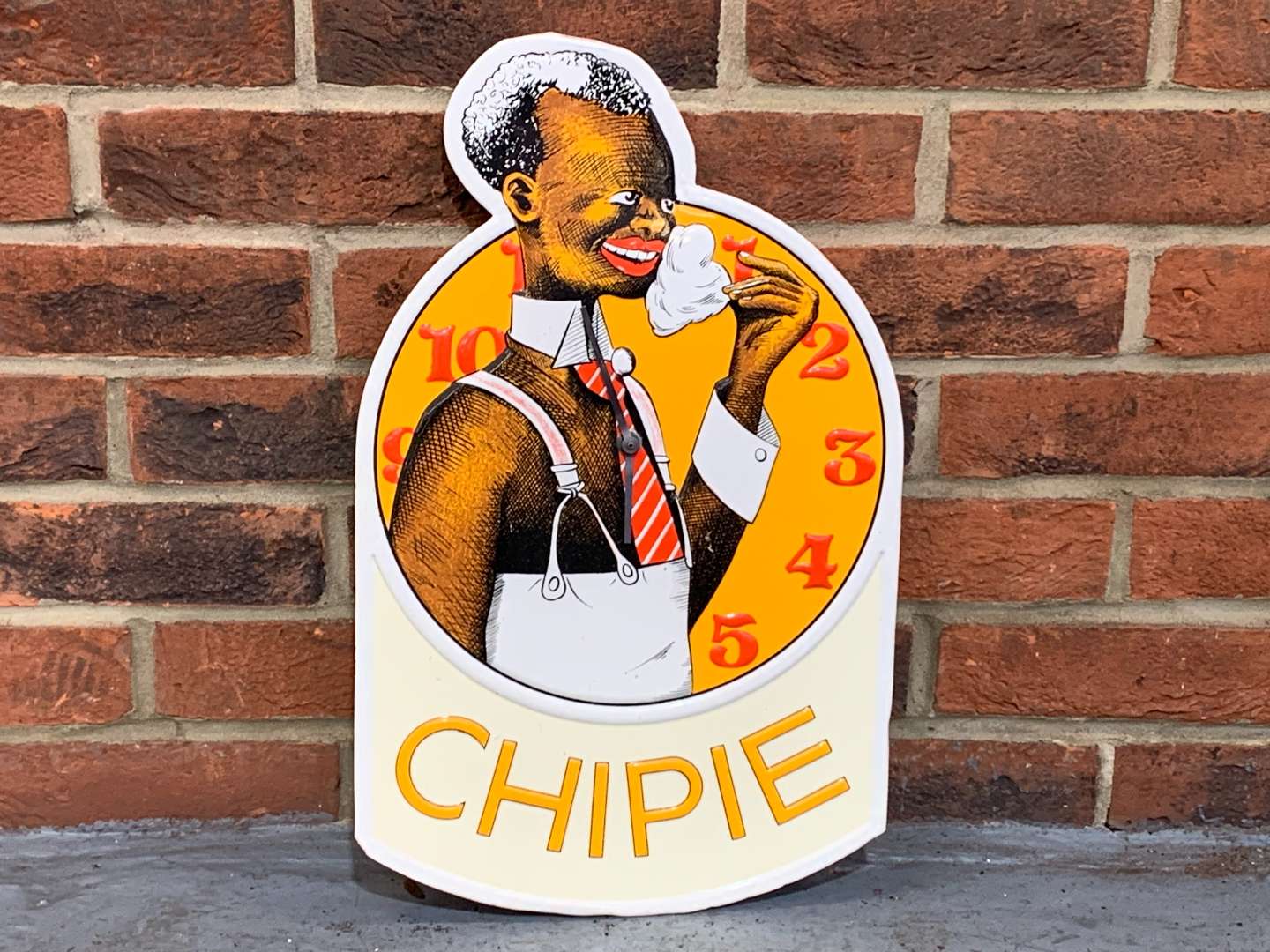 <p>Chipie Pressed Tin Clock&nbsp;</p>