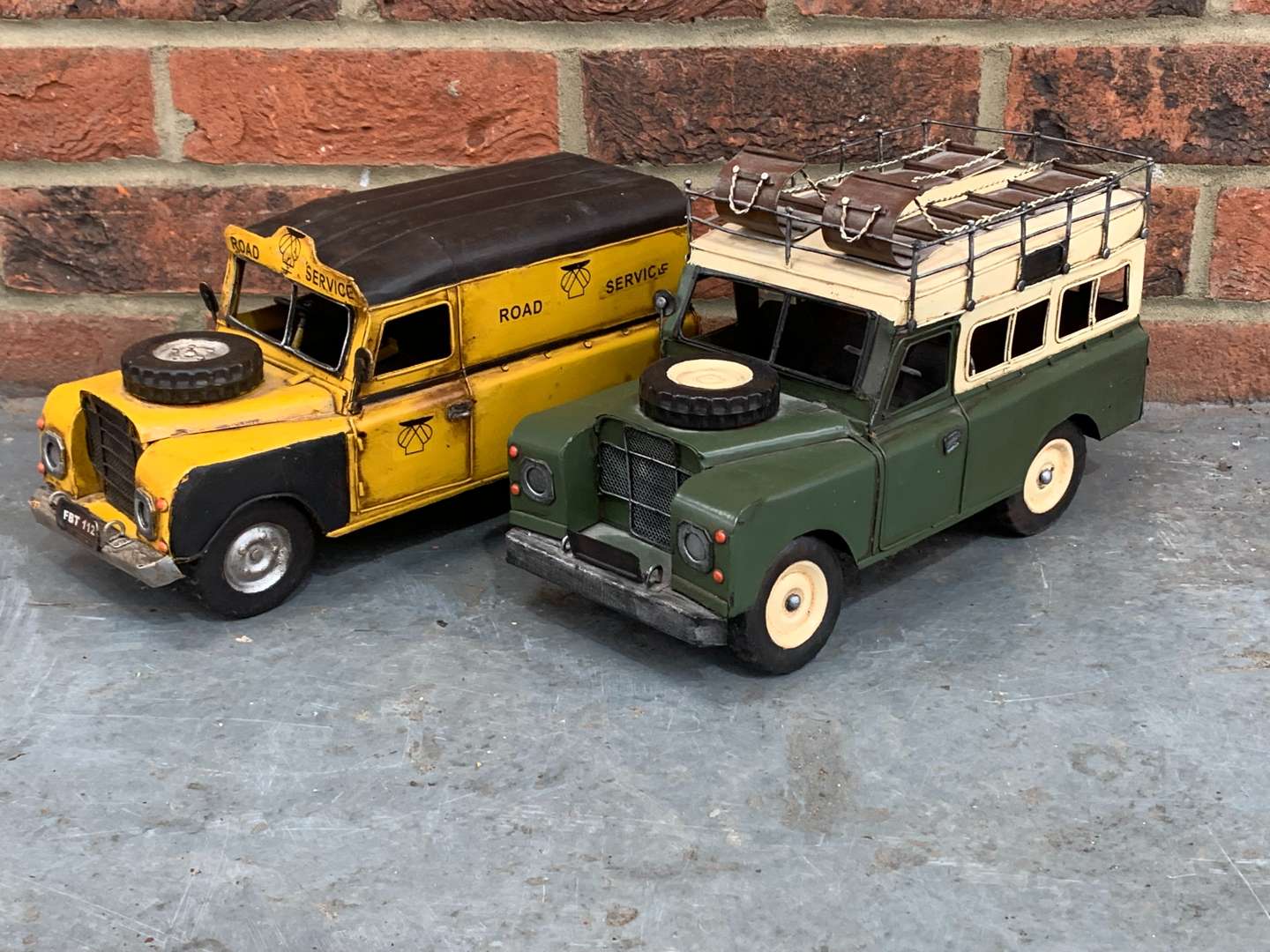 <p>Two Modern Metal Land Rover Model Cars</p>