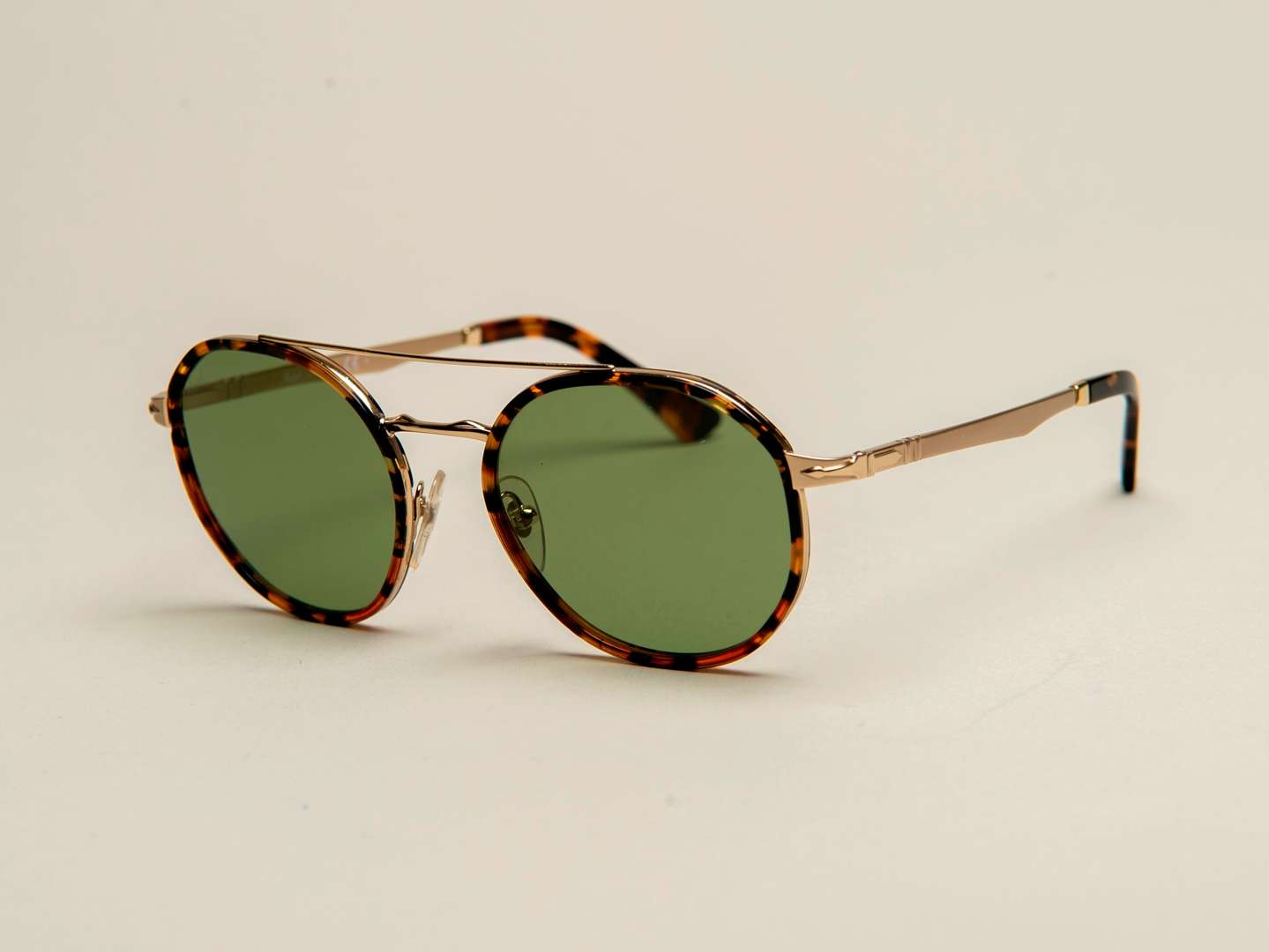 <p>PERSOL, a pair of Italian gilt and tortoiseshell sunglasses</p>