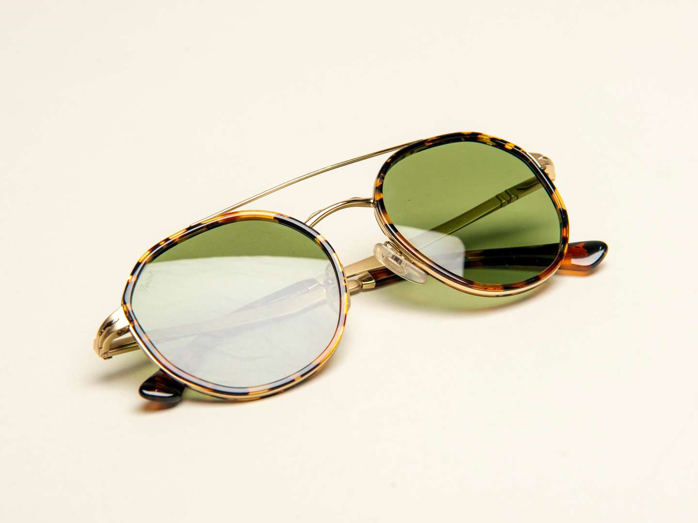 <p>PERSOL, a pair of Italian gilt and tortoiseshell sunglasses</p>