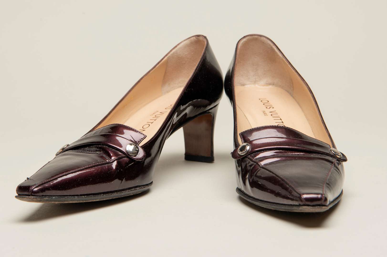 <p>LOUIS VUITTON, a pair of dark bronze, patent leather pumps</p>