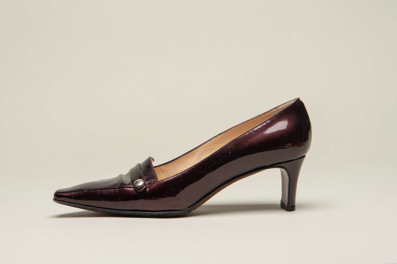 <p>LOUIS VUITTON, a pair of dark bronze, patent leather pumps</p>