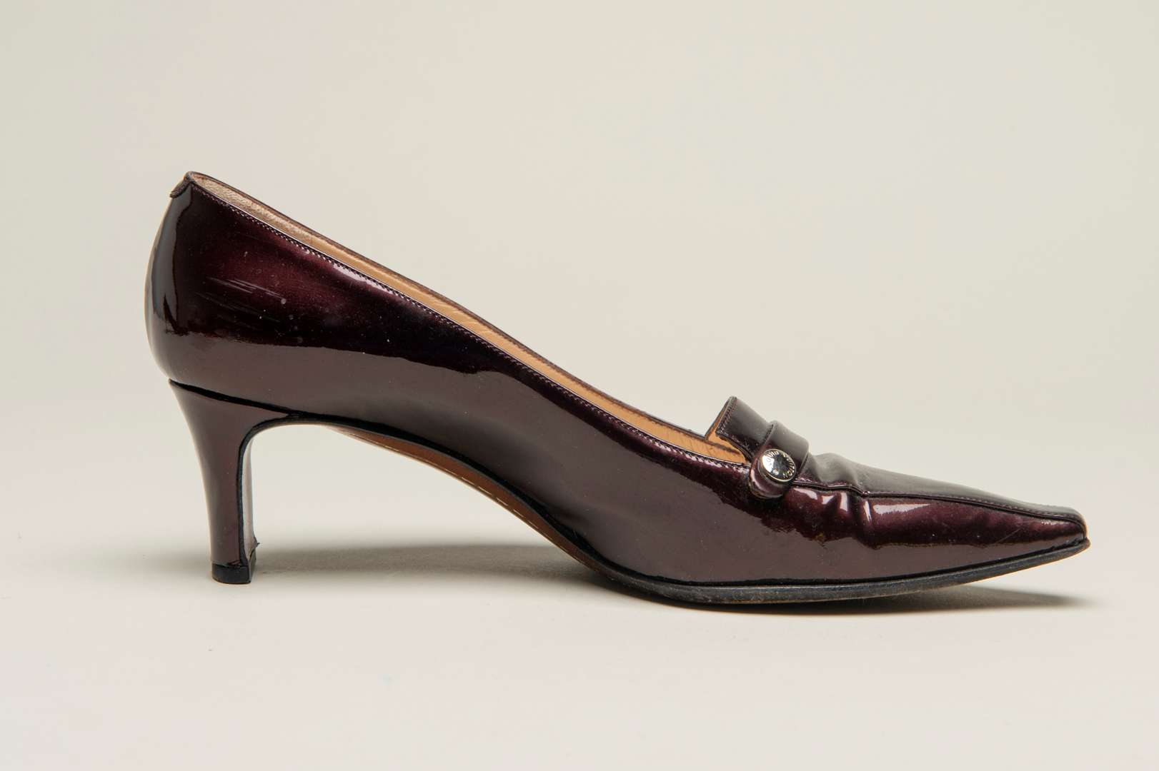 <p>LOUIS VUITTON, a pair of dark bronze, patent leather pumps</p>