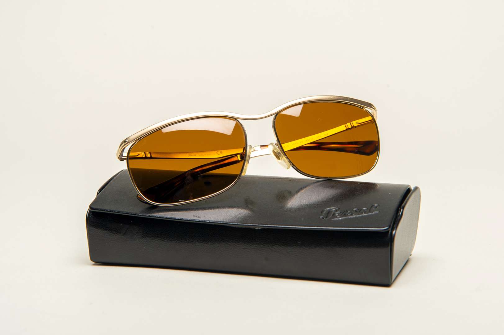 <p>PERSOL, a pair of Italian gilt framed sunglasses</p>