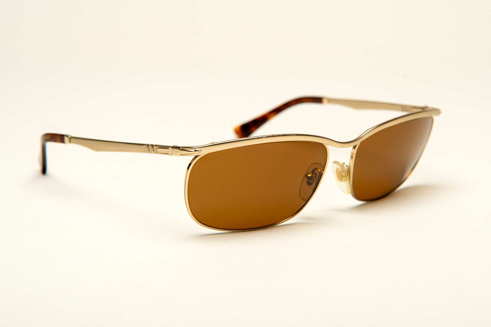 <p>PERSOL, a pair of Italian gilt framed sunglasses</p>