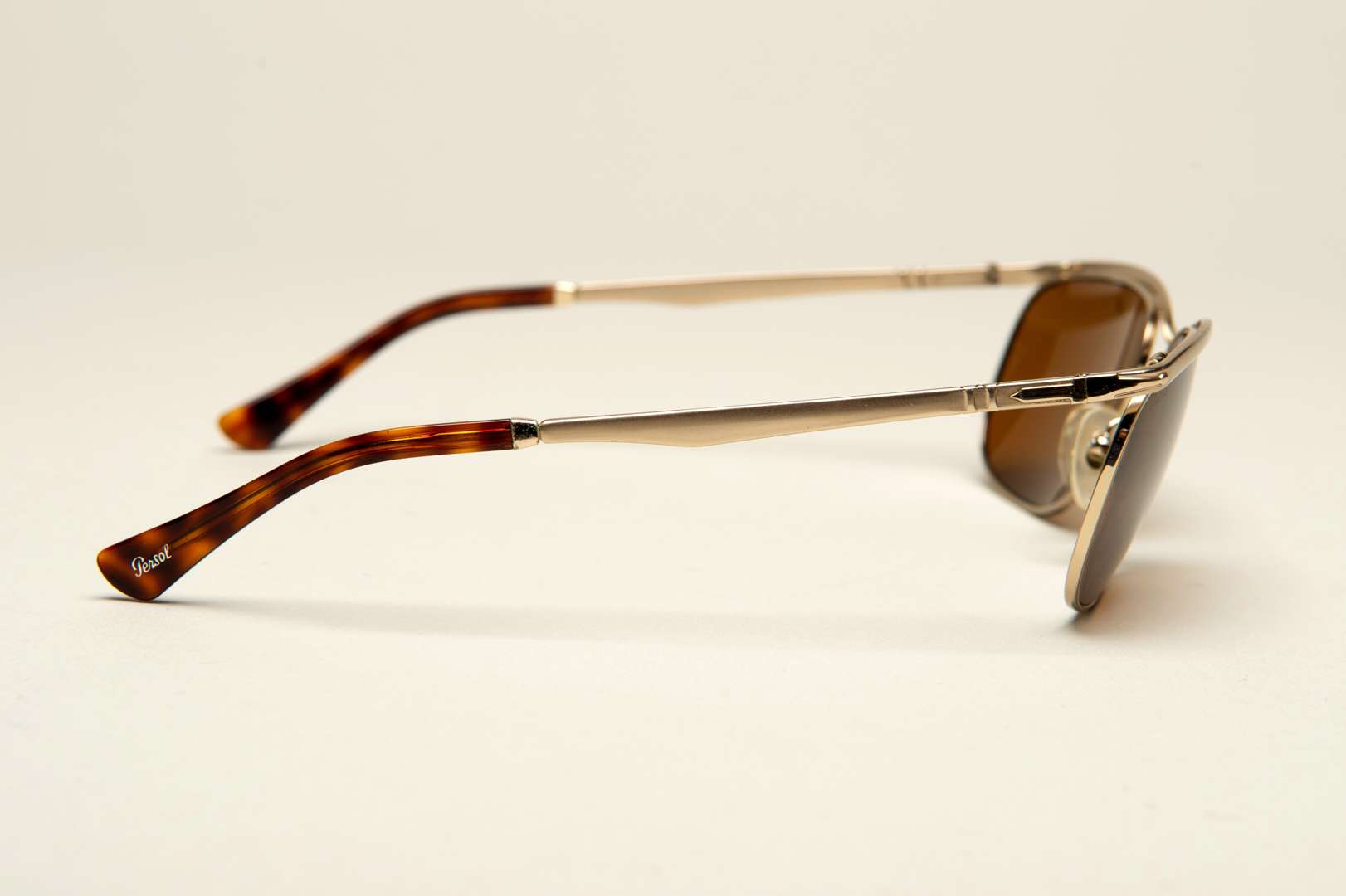 <p>PERSOL, a pair of Italian gilt framed sunglasses</p>