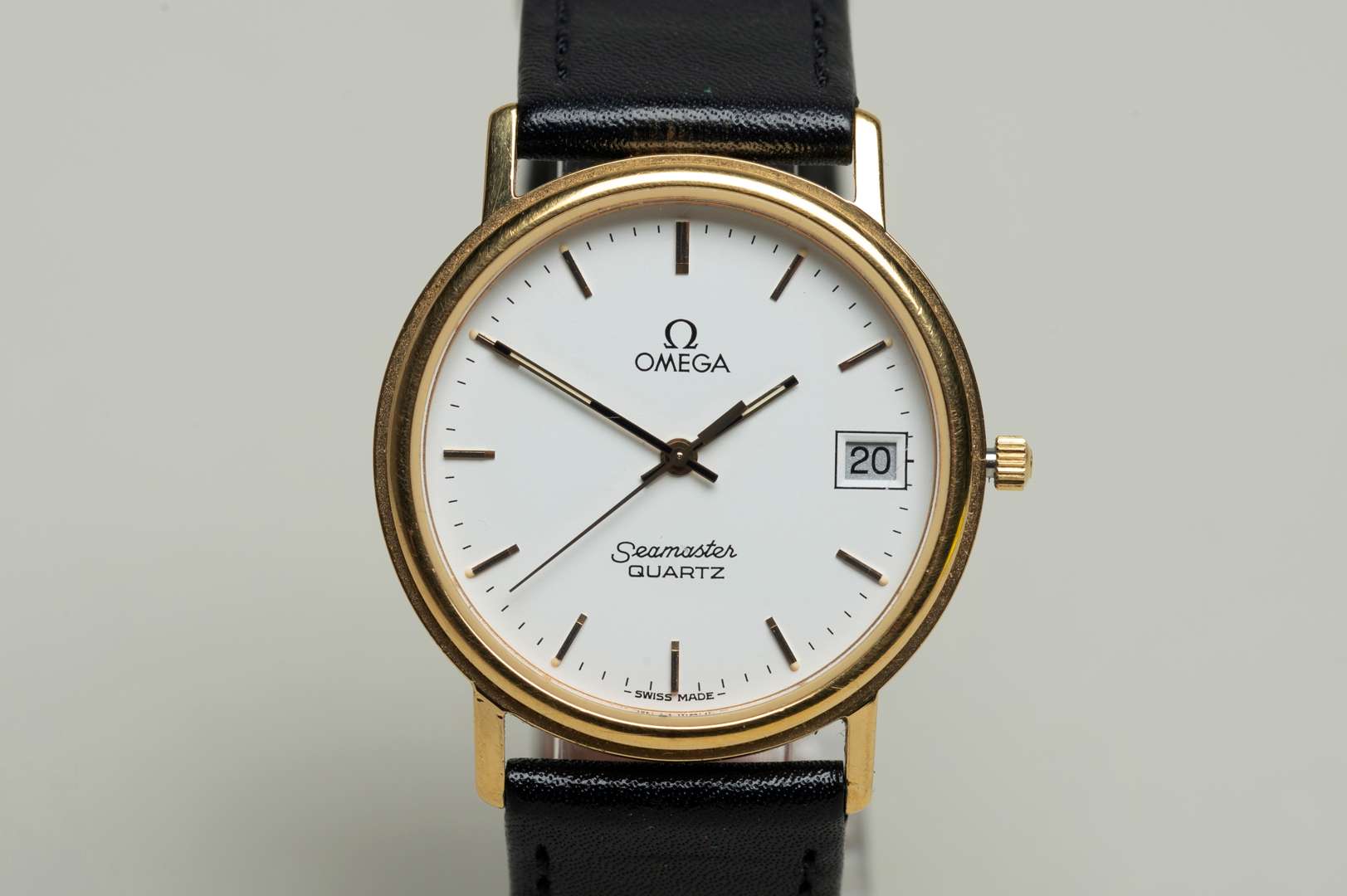 <p>OMEGA, a modern gold plated, quartz, centre seconds, calendar wristwatch.</p>