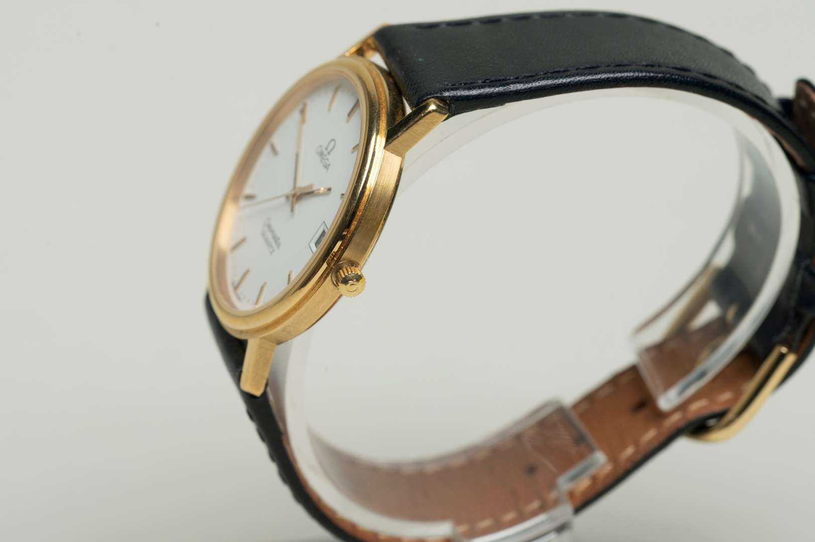 <p>OMEGA, a modern gold plated, quartz, centre seconds, calendar wristwatch.</p>