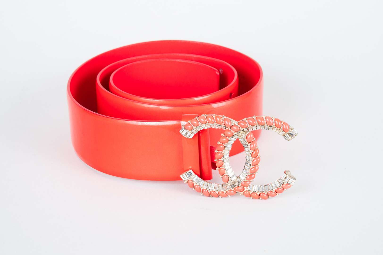 <p>CHANEL, coral red, patent leather belt</p>