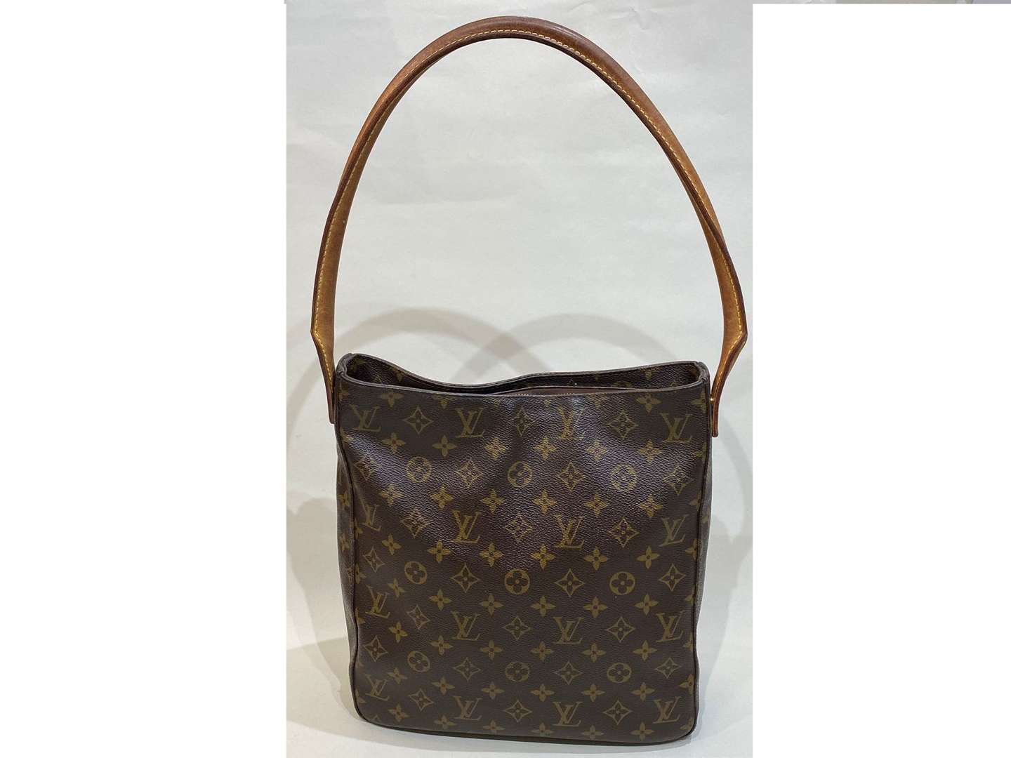 <p>LOUIS VUITTON, Looping, tan stitched leather and monogrammed shoulder bag</p>