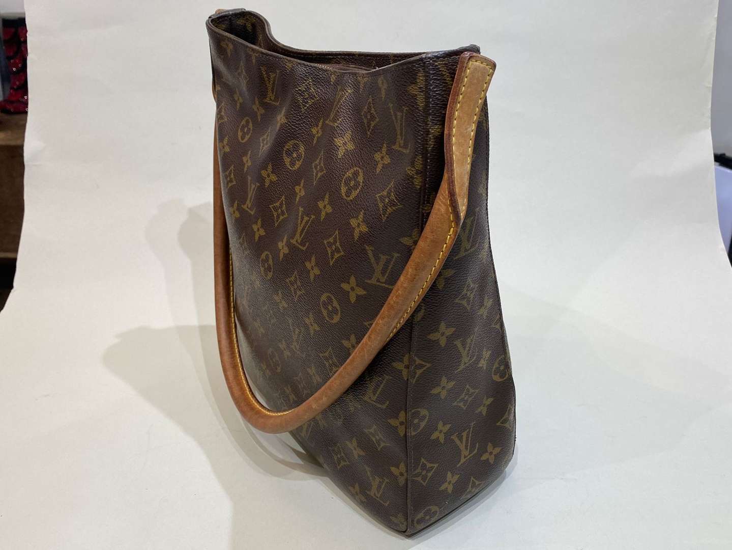 <p>LOUIS VUITTON, Looping, tan stitched leather and monogrammed shoulder bag</p>