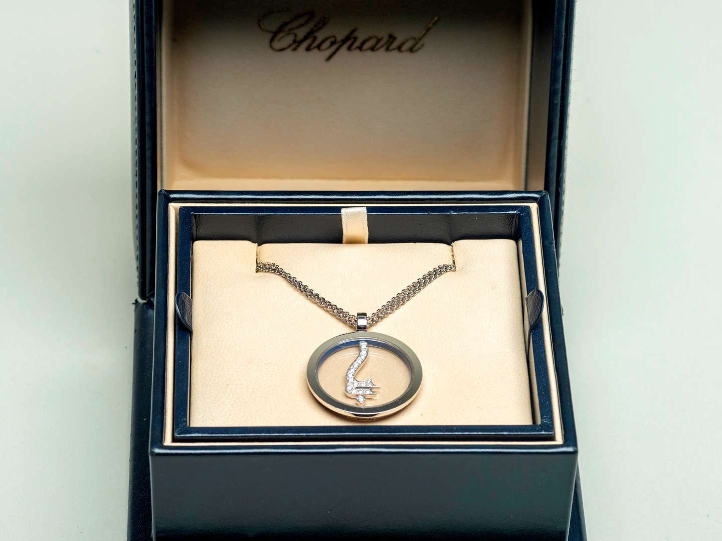 <p>CHOPARD for GODOLPHIN, a modern 18ct white gold and diamond set pendant and chain</p>