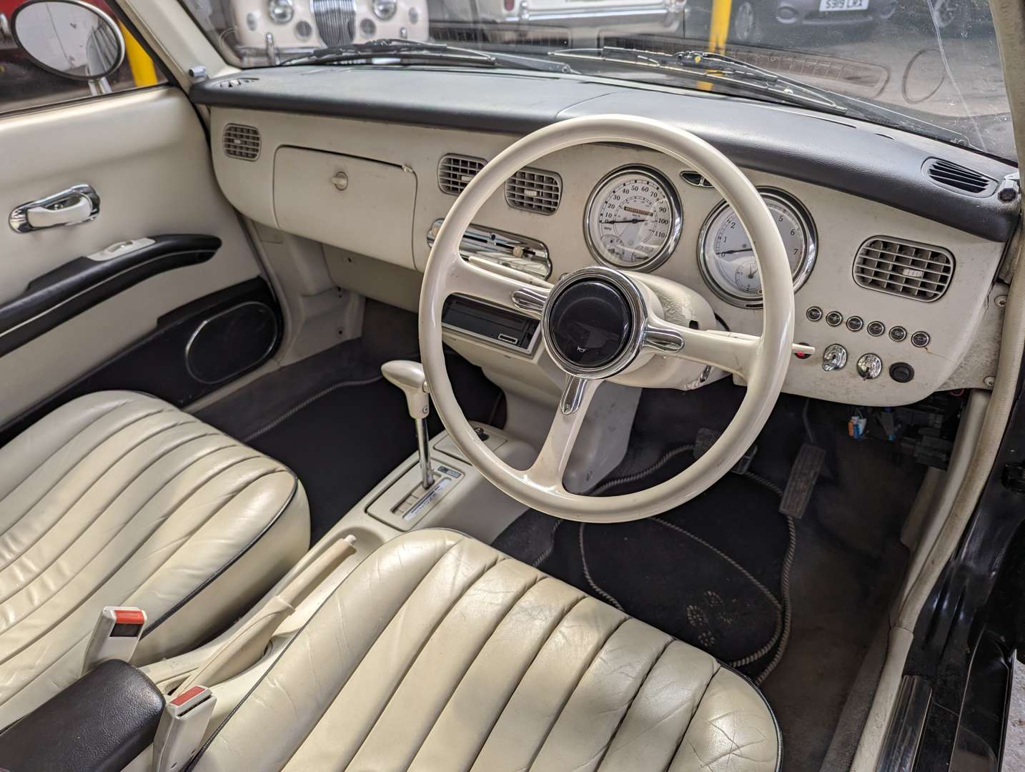 <p>1991 NISSAN FIGARO AUTO&nbsp;</p>