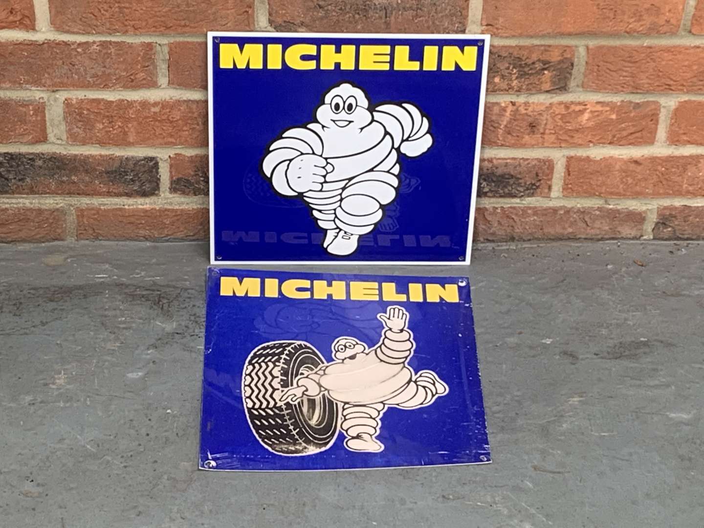 <p>Two Small Michelin Signs</p>