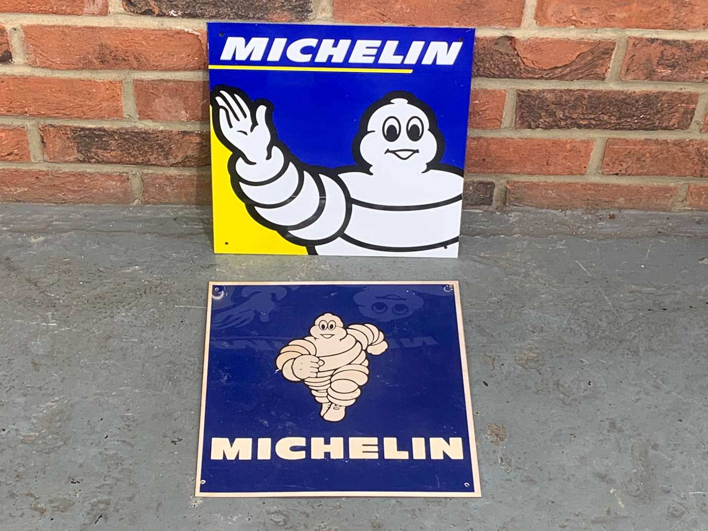 <p>Two Small Michelin Signs</p>