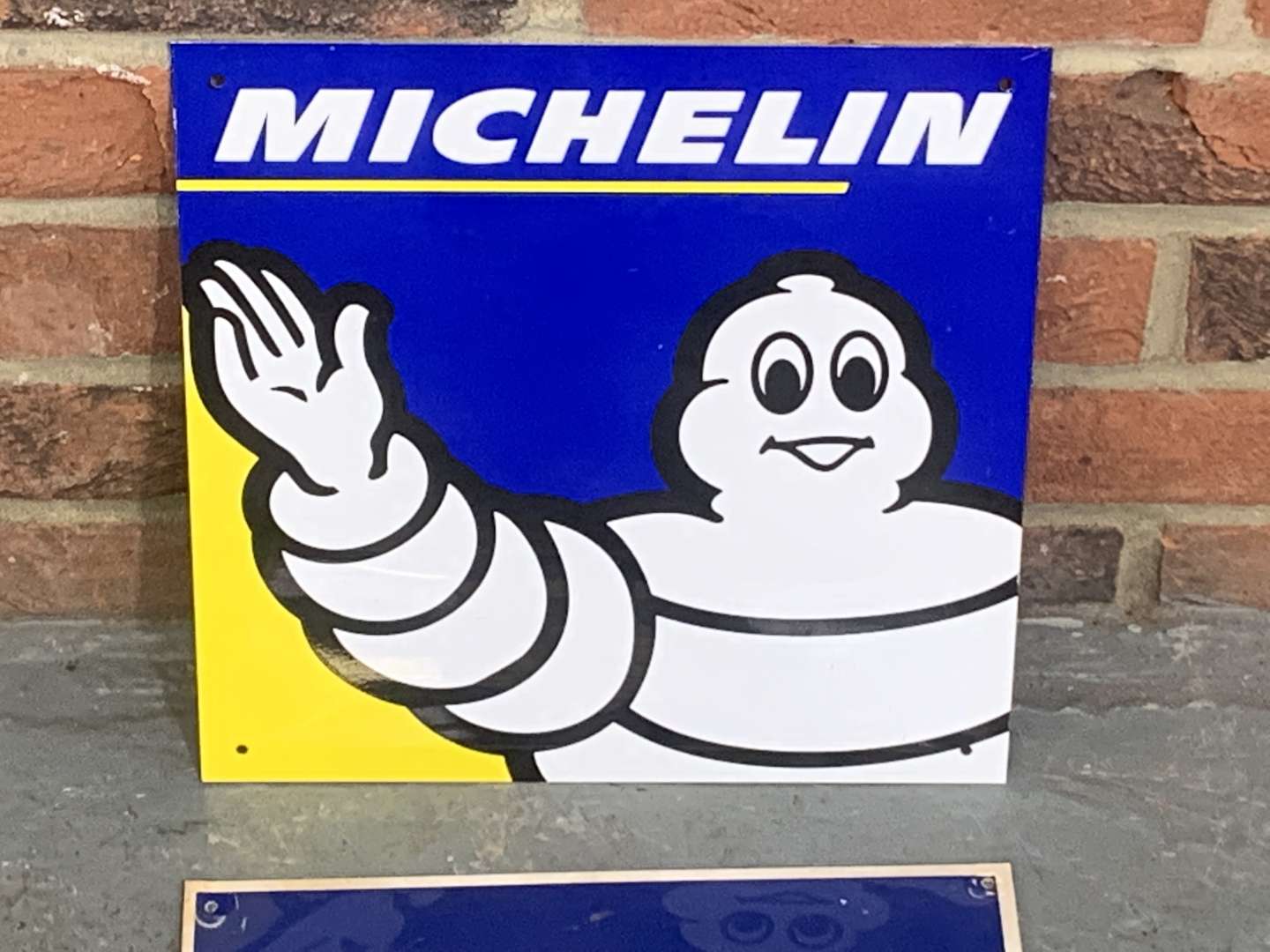 <p>Two Small Michelin Signs</p>