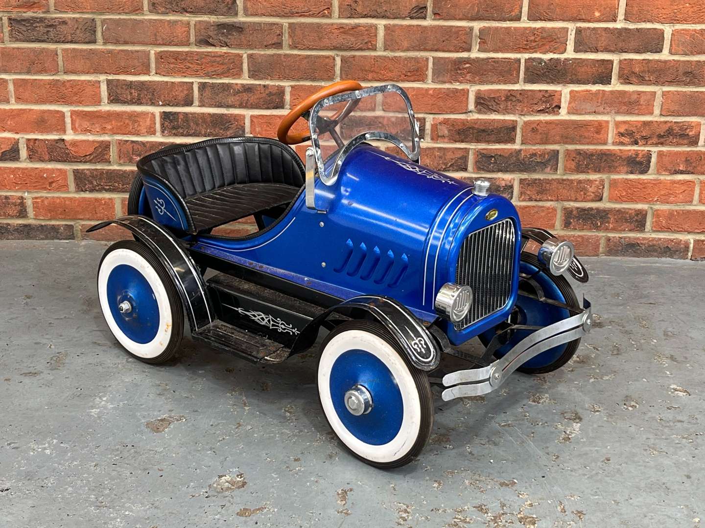 <p>Childs Tin Plate Pedal Car</p>