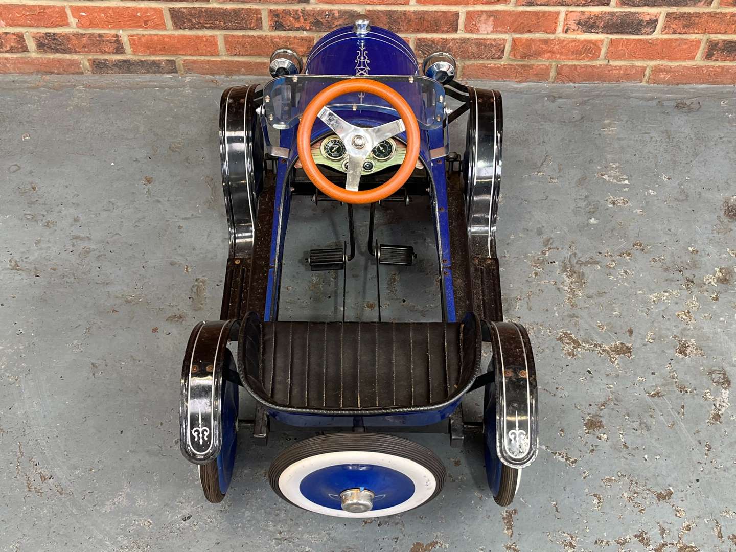 <p>Childs Tin Plate Pedal Car</p>