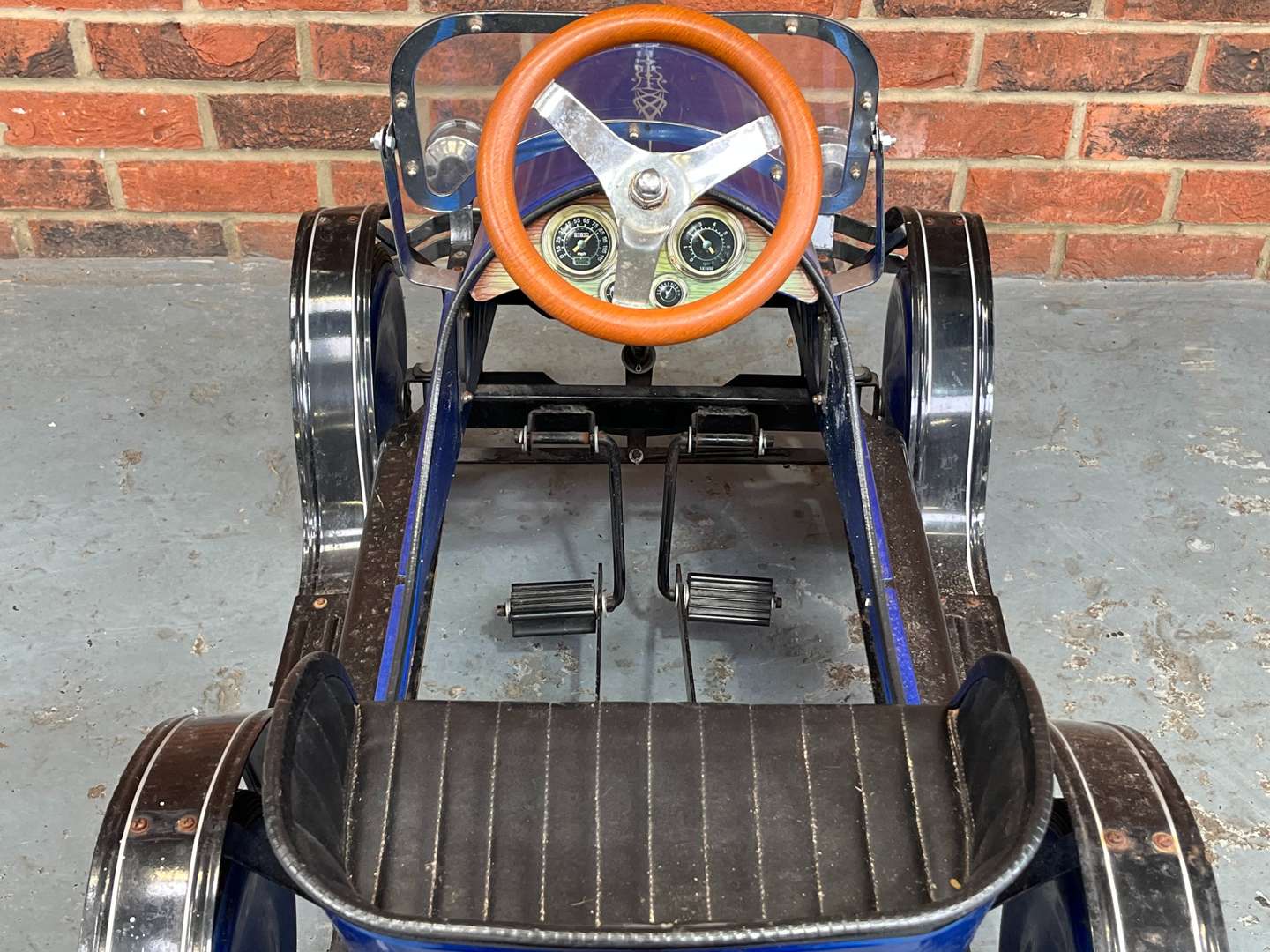 <p>Childs Tin Plate Pedal Car</p>