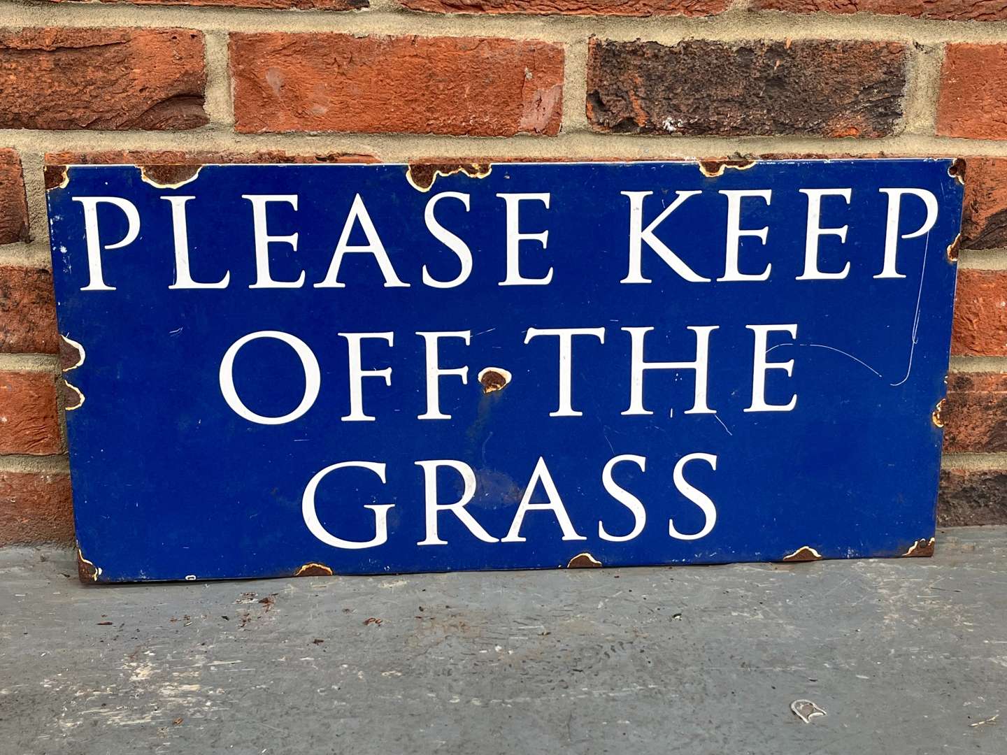 <p>Please Keep Off The Grass Enamel Sign</p>