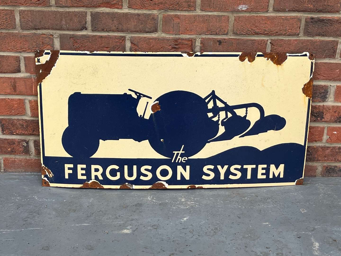 <p>The Ferguson System Enamel Sign</p>