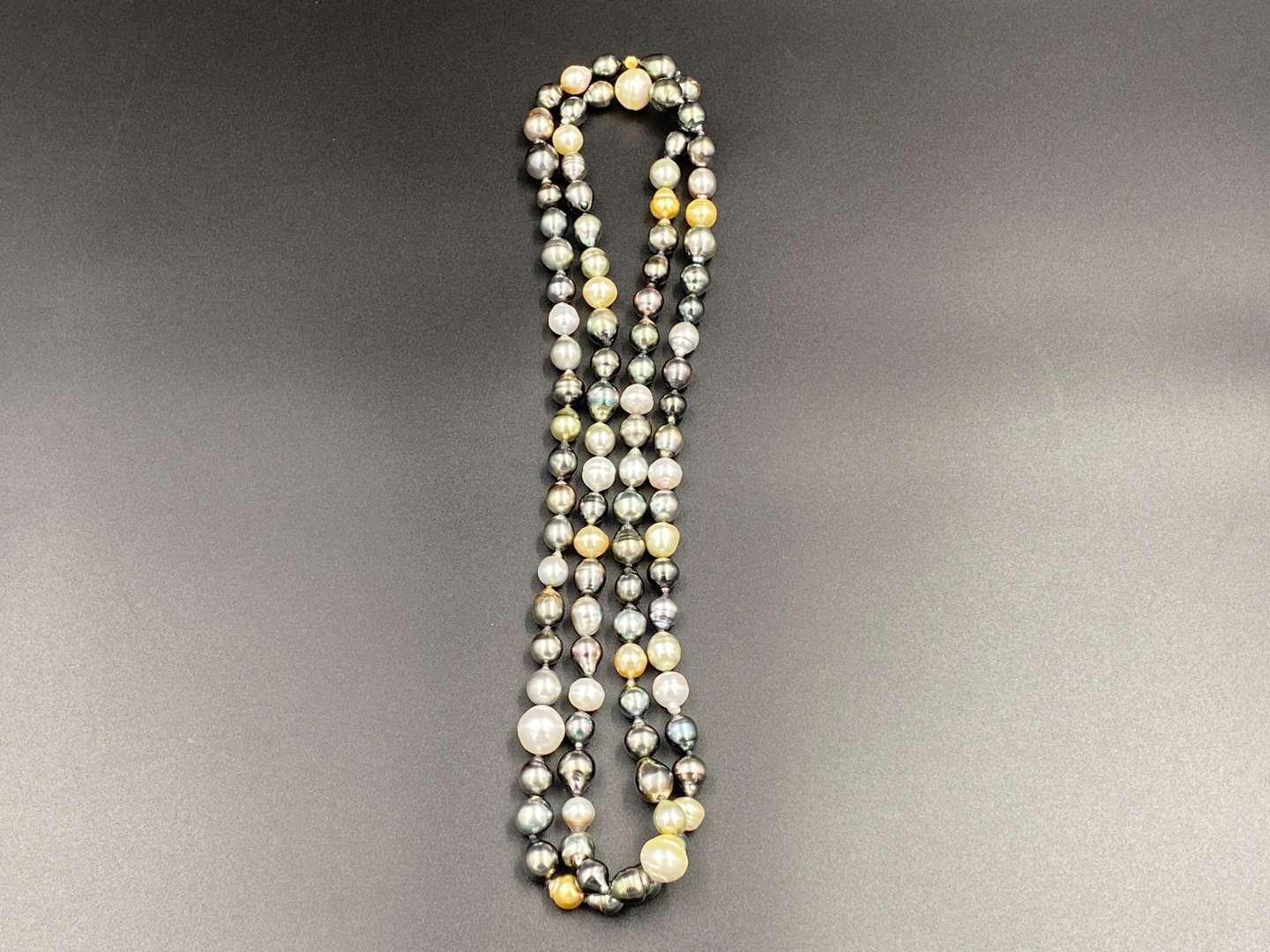 <p>SCHOEFFEL, a signed, single strand of colored freshwater pearls.</p>