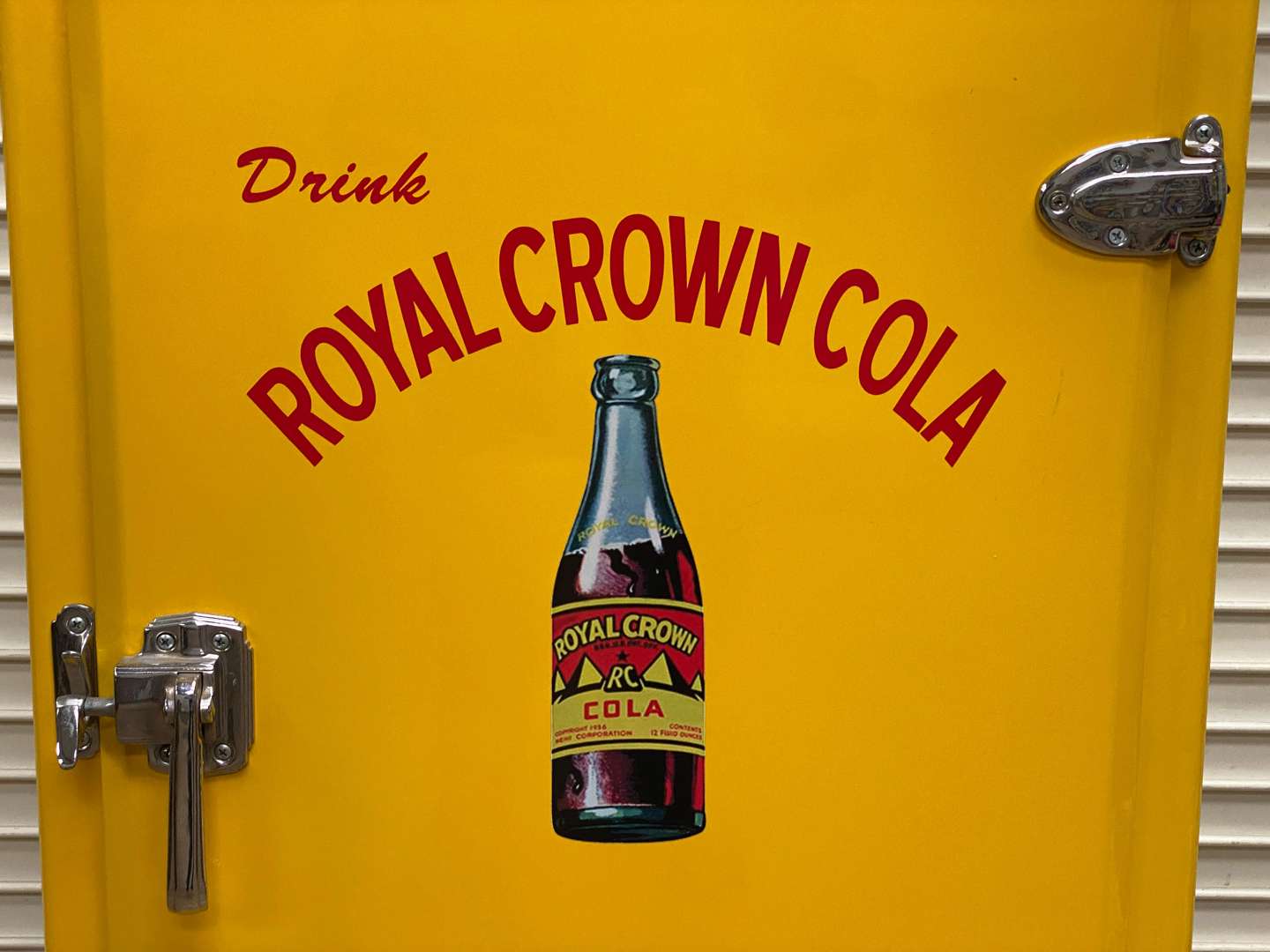 <p>FRIGIDAIRE, a 1940s American upright refrigerator, repainted in “Royal Crown Cola” livery</p>