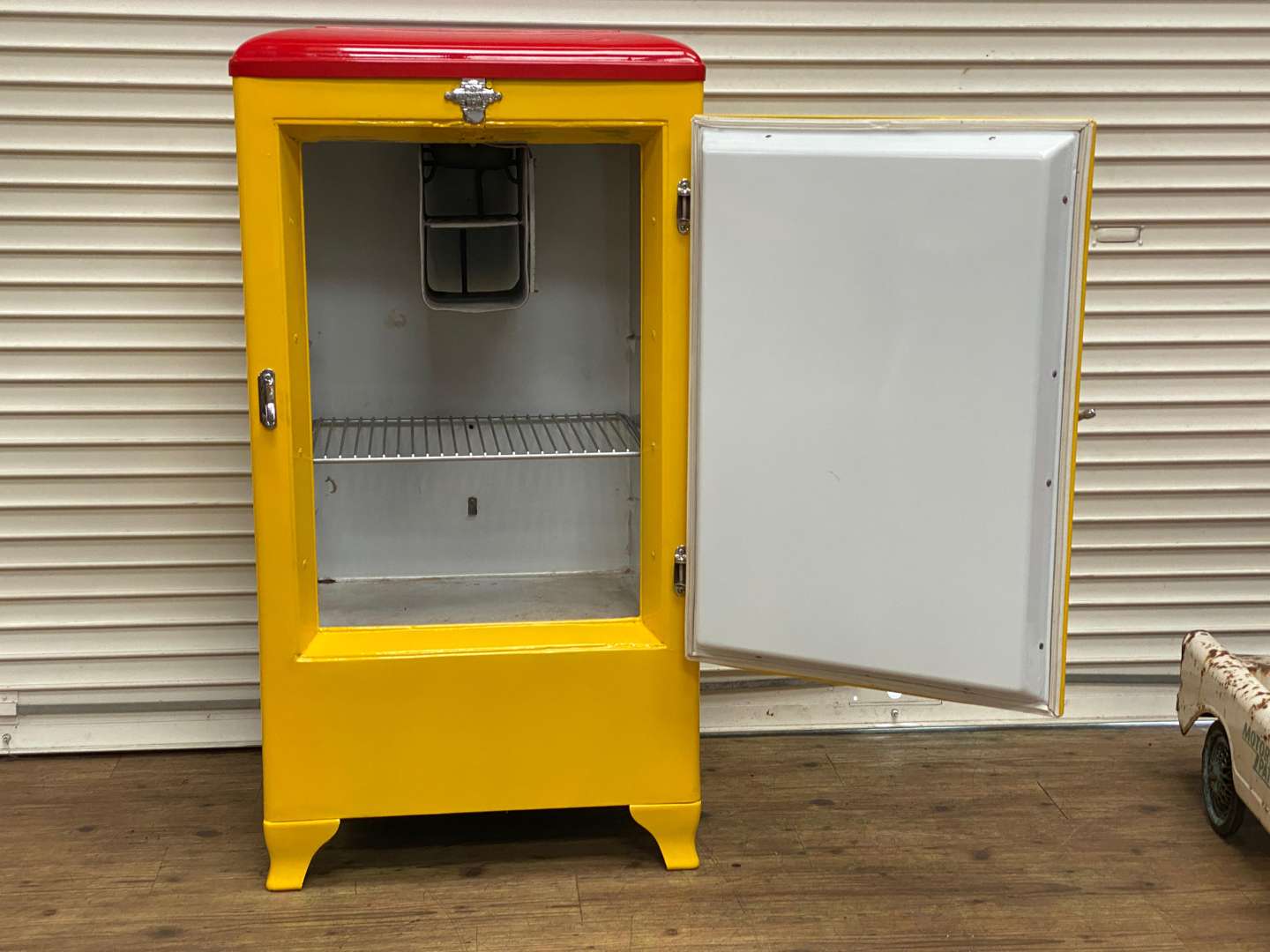 <p>FRIGIDAIRE, a 1940s American upright refrigerator, repainted in “Royal Crown Cola” livery</p>