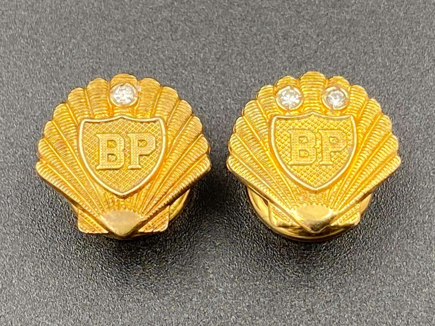 <p>SHELL-MEX & BP LTD, two 1950's 9ct gold and Diamond set “Long Service” lapel badges</p>