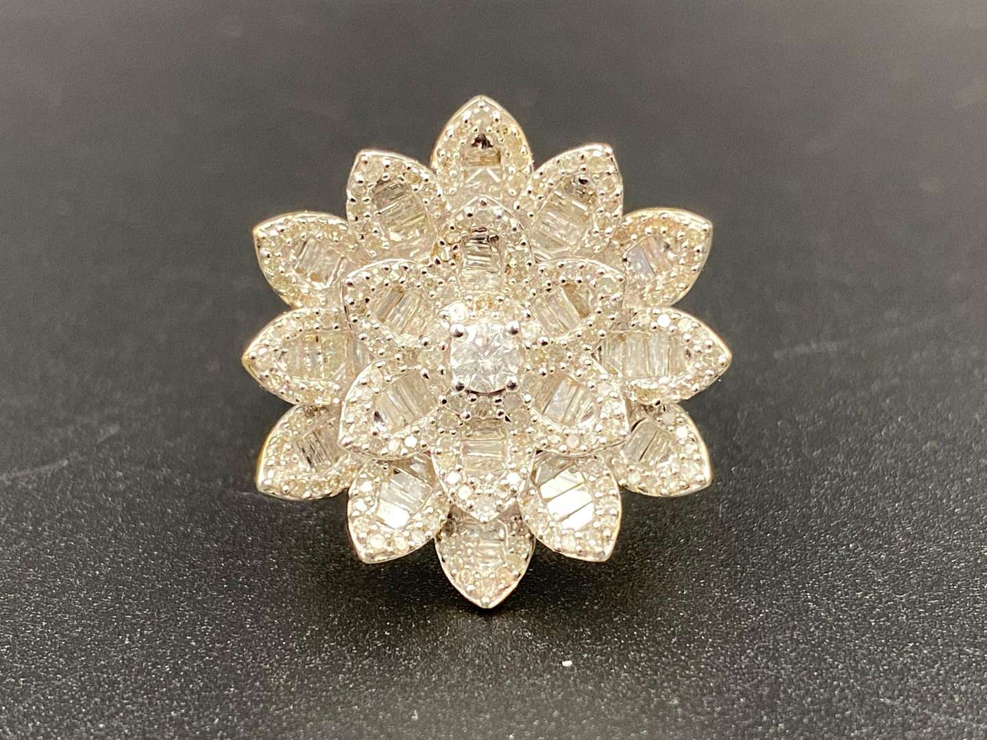 <p>A Lotus flower diamond cluster ring, in a 9 ct yellow gold mount.</p>