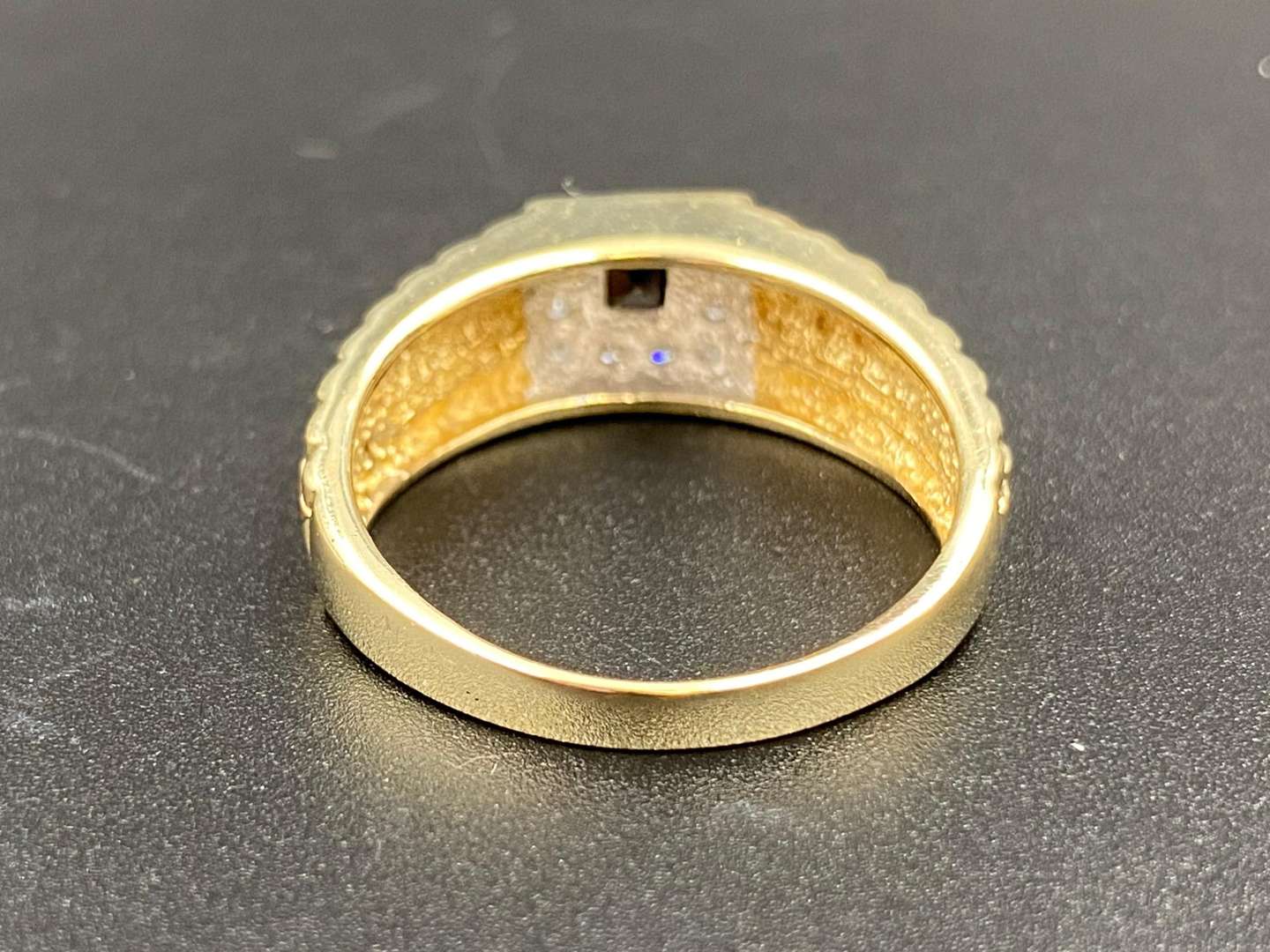 <p>A “Rolex” style, blue sapphire and 9ct yellow gold dress ring.</p>