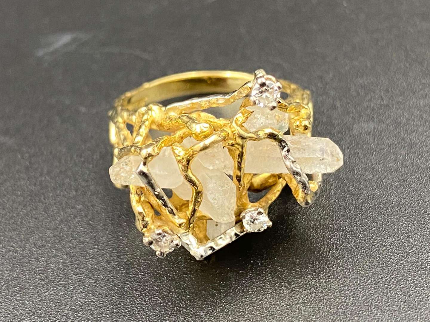 <p>A large quartz and diamond set, 18ct gold dress ring.</p>