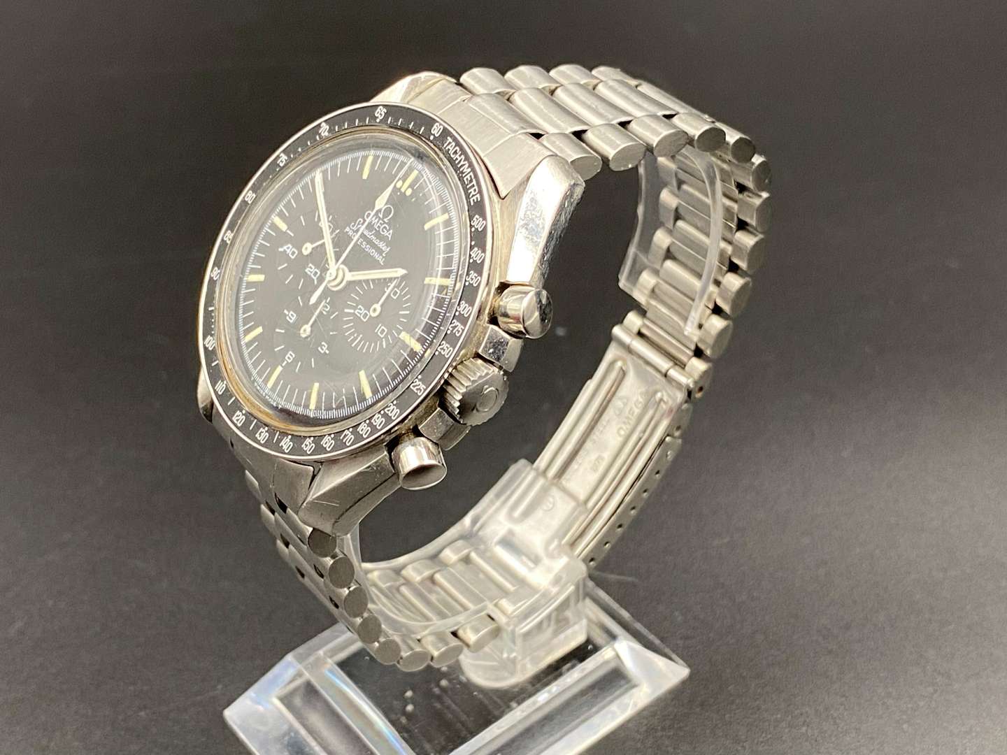 <p>OMEGA. Speedmaster, Moonwatch, stainless steel, two button chronograph, ST145.022. c 1971.</p>