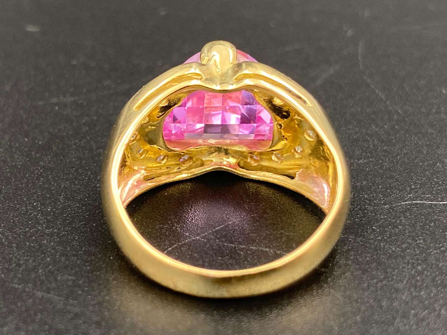 <p>A pink and white stone set dress ring in 18 ct yellow gold mount.</p>